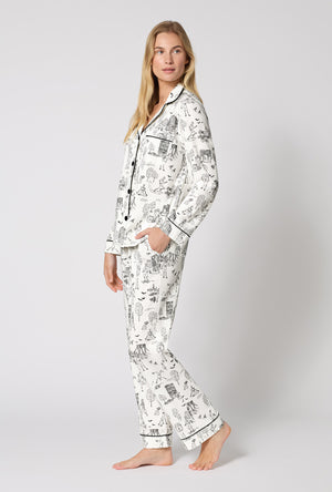 A Lady Wearing White Spooky In The City Long Sleeve Classic Stretch Jersey Pj Set in a side angled view pose