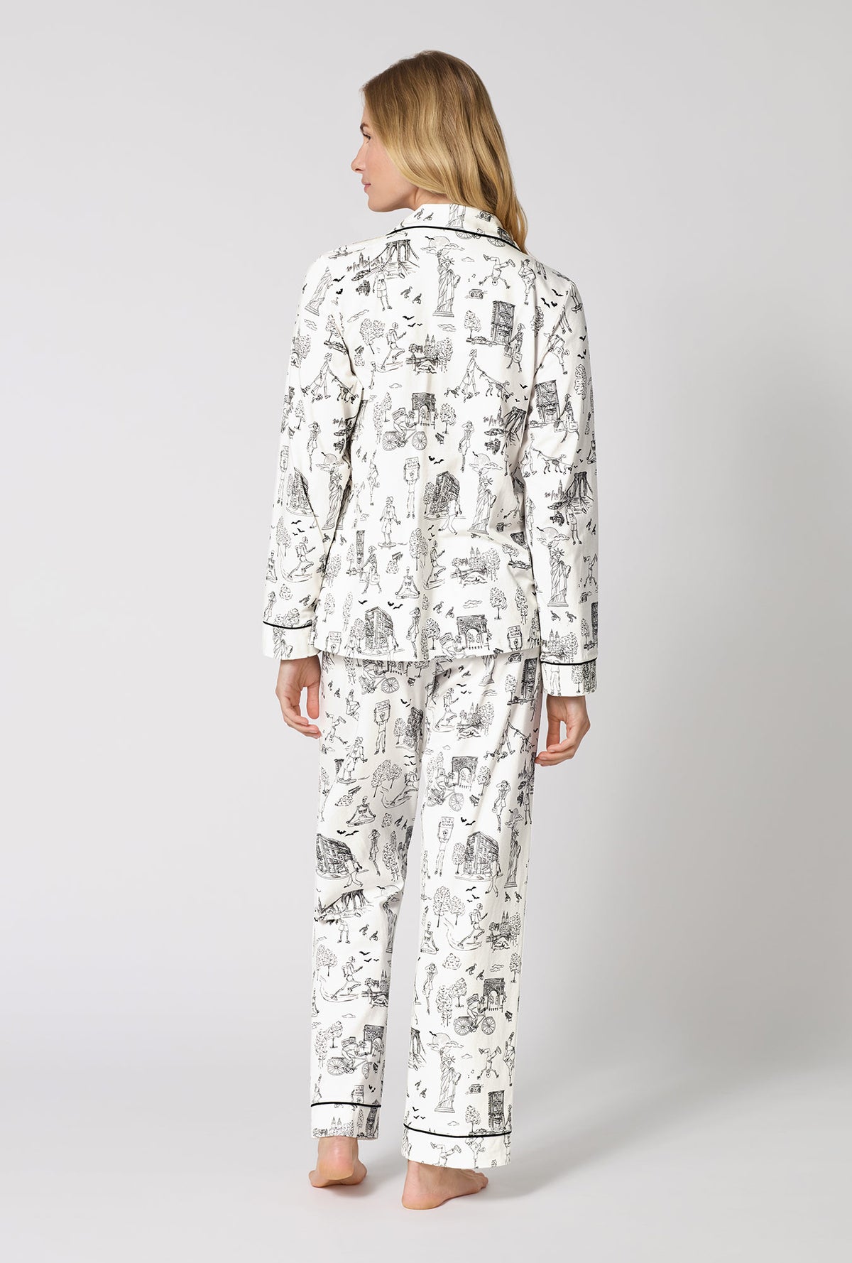 A Lady Wearing White Spooky In The City Long Sleeve Classic Stretch Jersey Pj Set in a back view pose