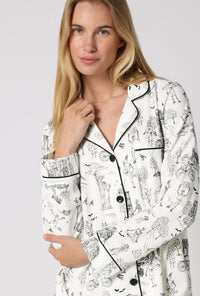 A Lady Wearing White Spooky In The City Long Sleeve Classic Stretch Jersey Pj Set in a close up view pose
