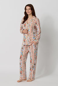 A lady wearing Rifle Paper Co. x BedHead PJs Holly Jolly Nutcracker Long Sleeve Classic Stretch Jersey Pj Set