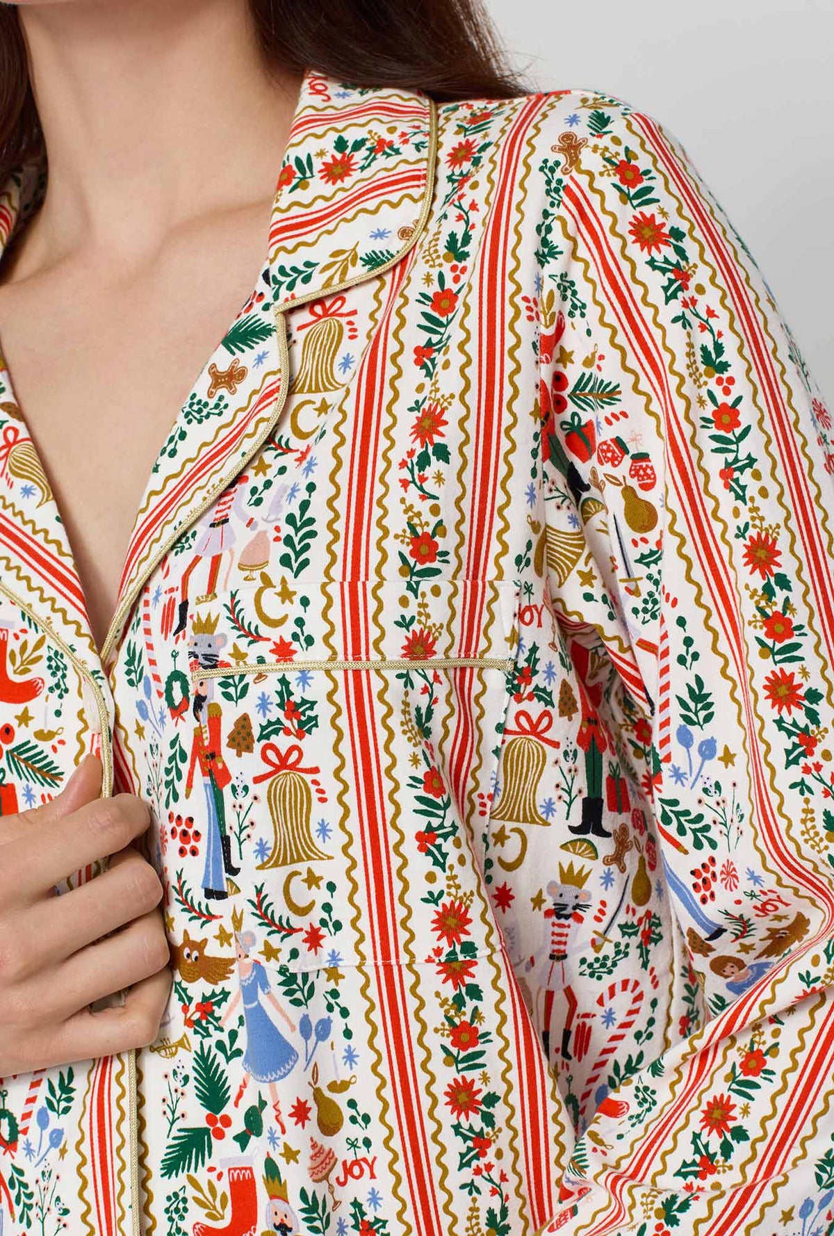 A lady wearing Rifle Paper Co. x BedHead PJs Holly Jolly Nutcracker Long Sleeve Classic Stretch Jersey Pj Set closer look