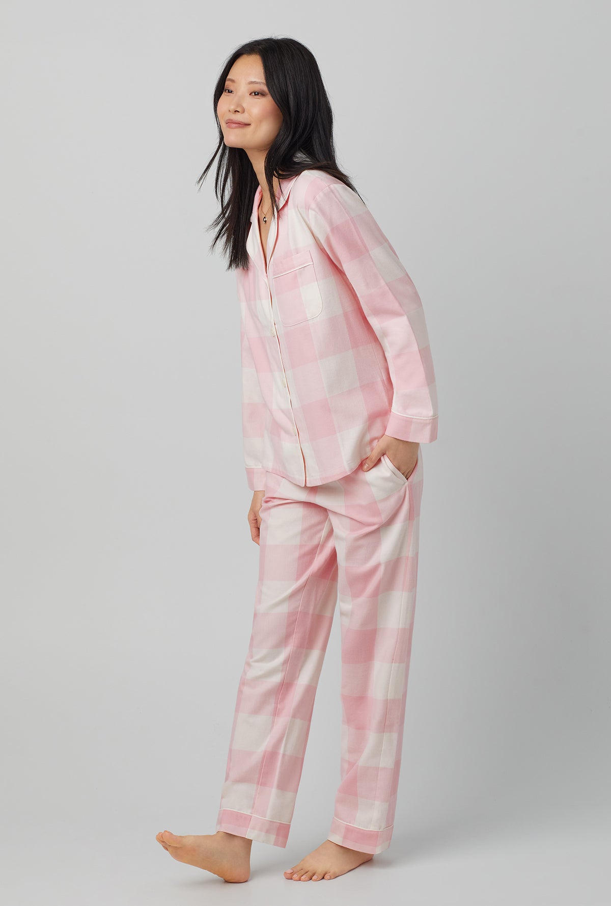 A lady wearing long sleeve classic flannel twill pj set with checking in print