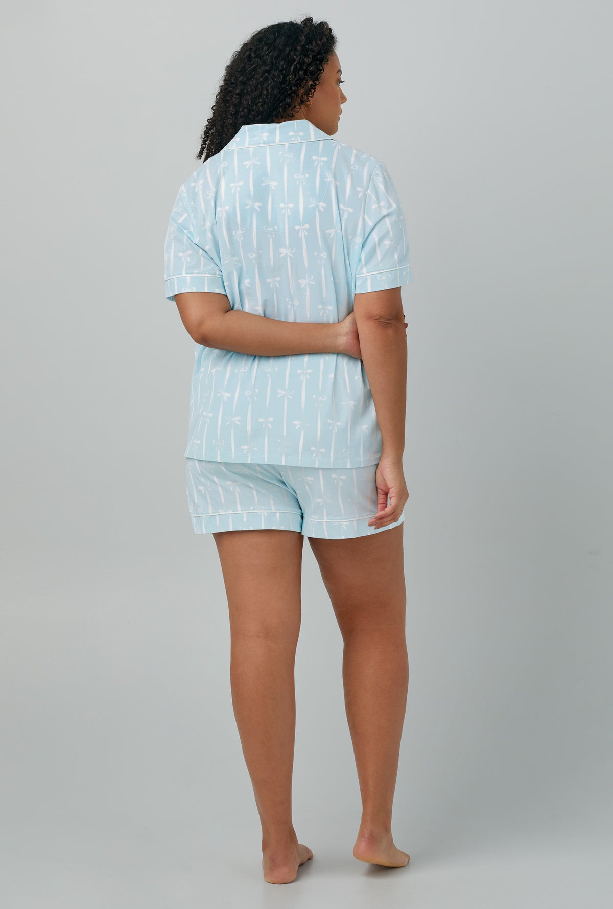 A lady wearing Short Sleeve Classic Shorty Stretch Jersey PJ Set with tying the knot print