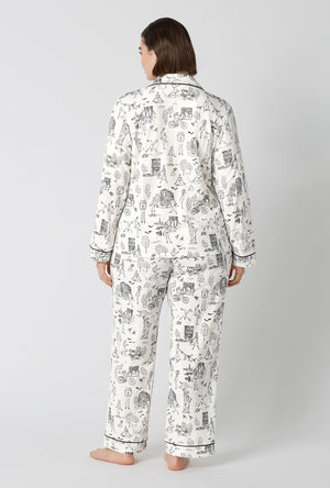 A Lady Wearing Plus Size White Spooky In The City Long Sleeve Classic Stretch Jersey Pj Set in a back view pose