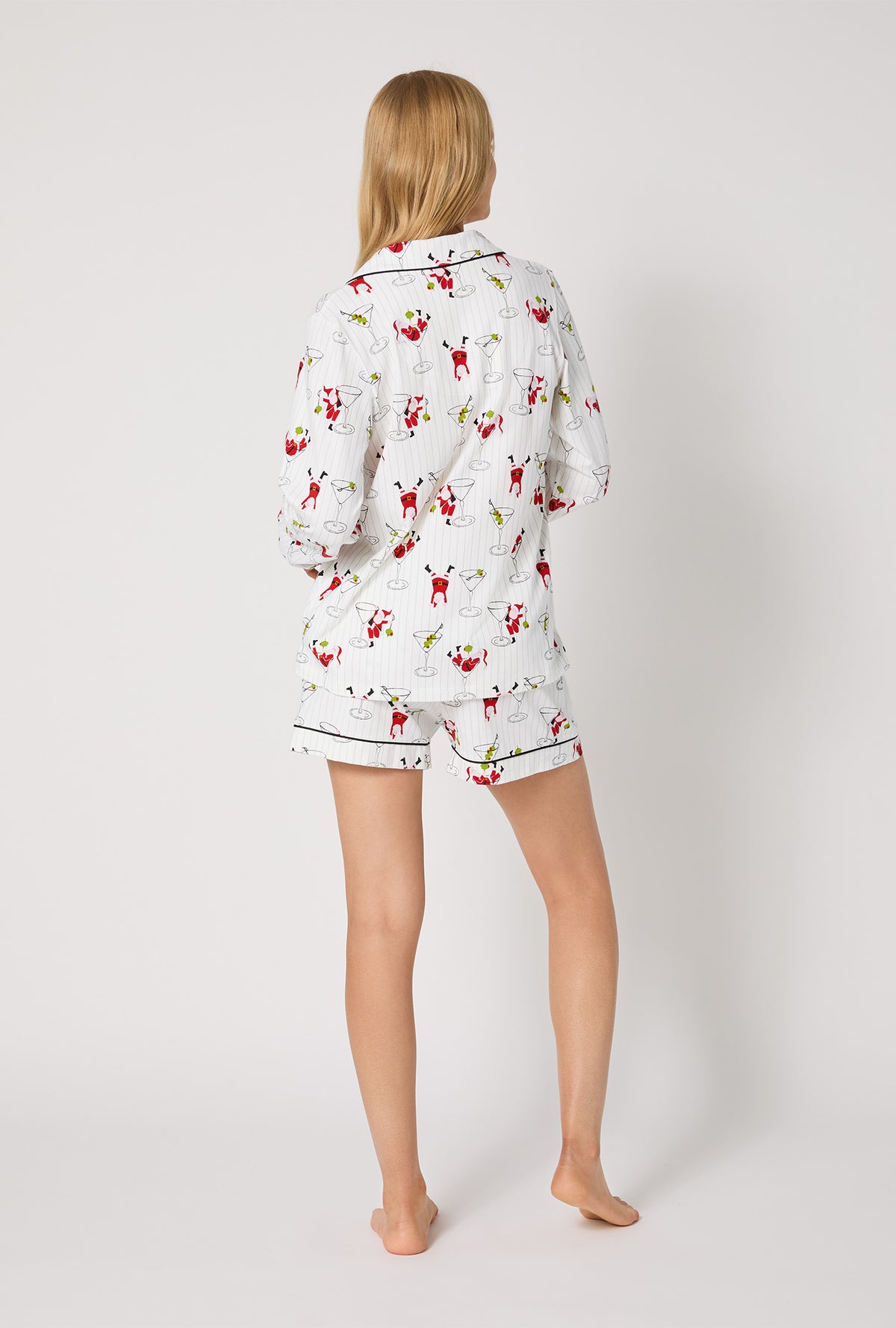 A lady wearing Tipsy Santa Long Sleeve Classic Stretch Jersey Shorty Pj Set