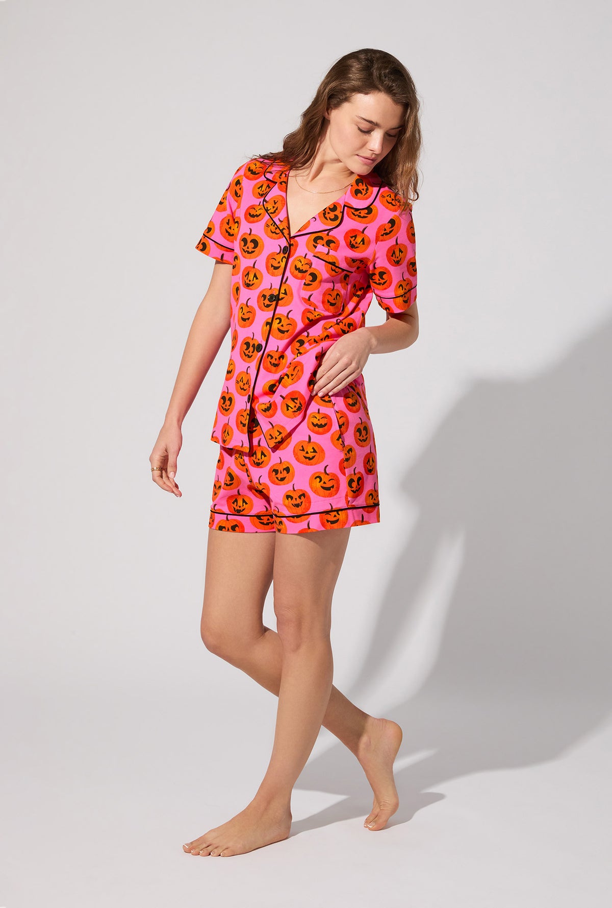 A lady wearing Jolly Jack-O-Lanterns Short Sleeve Classic Shorty Stretch Jersey PJ Set