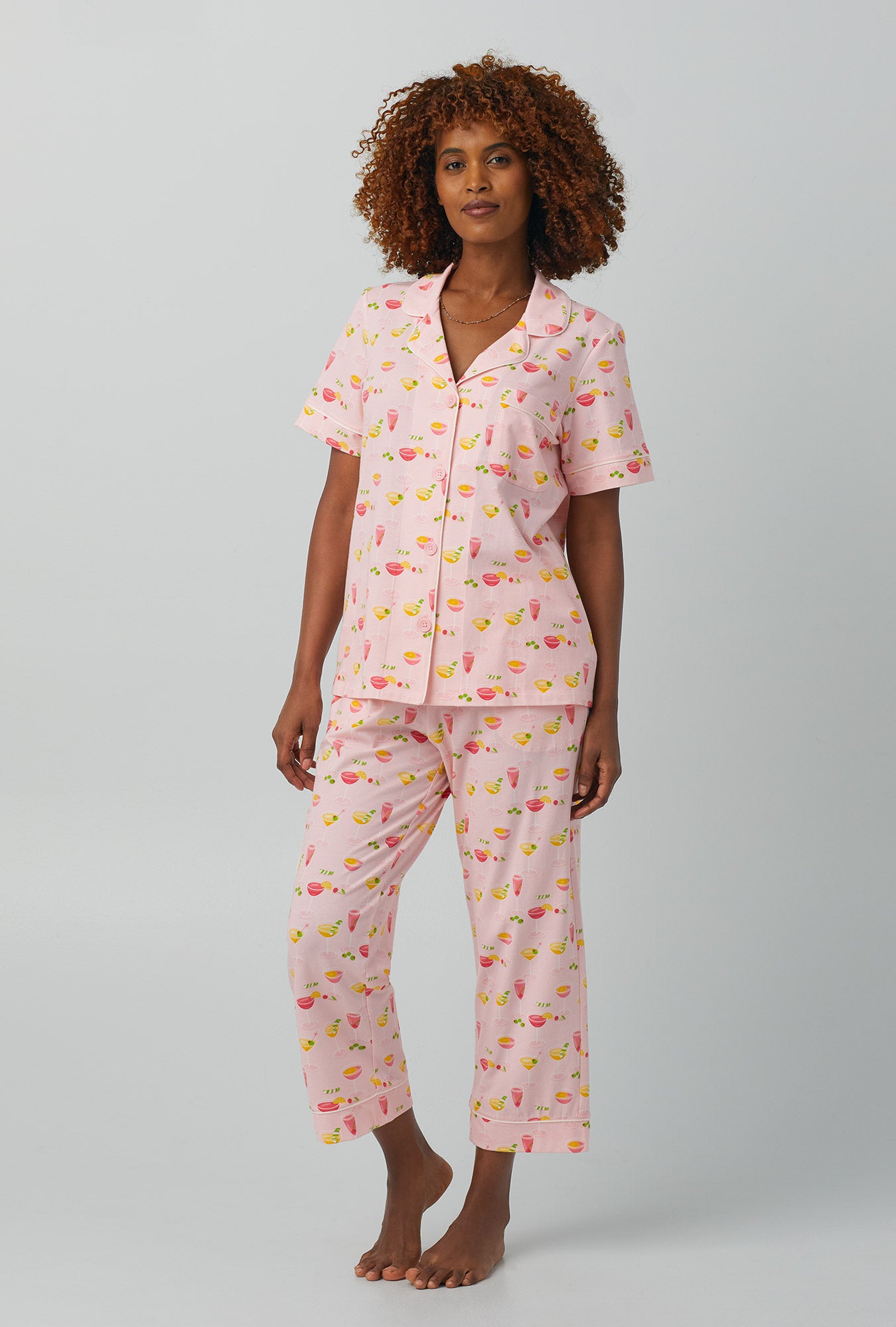A lady wearing pink  Short Sleeve Classic Stretch Jersey Cropped PJ Set with Pink Mixology print