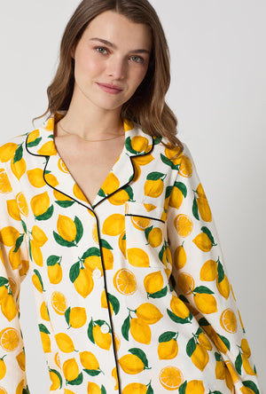 A lady wearing White and  Yellow Long Sleeve Classic Stretch Jersey Pj Set side view
