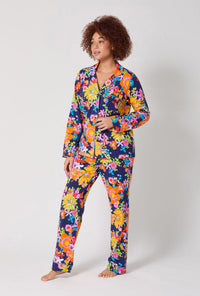 A lady wearing BedHead x Trina Turk Bay Street Bloom Long Sleeve Classic Stretch Jersey Pj Set