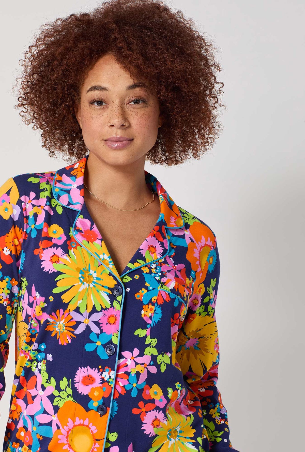 A lady wearing BedHead x Trina Turk Bay Street Bloom Long Sleeve Classic Stretch Jersey Pj Set