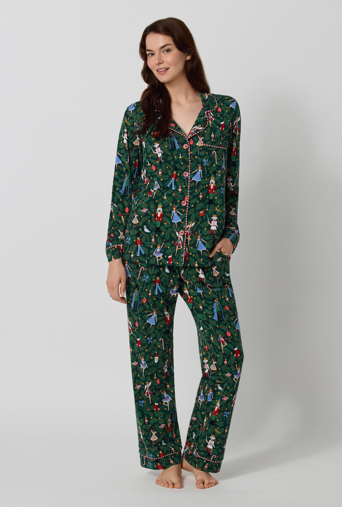 A lady wearing Rifle Paper Co. x BedHead PJs Nutcracker Long Sleeve Classic Stretch Jersey Pj Set looking down