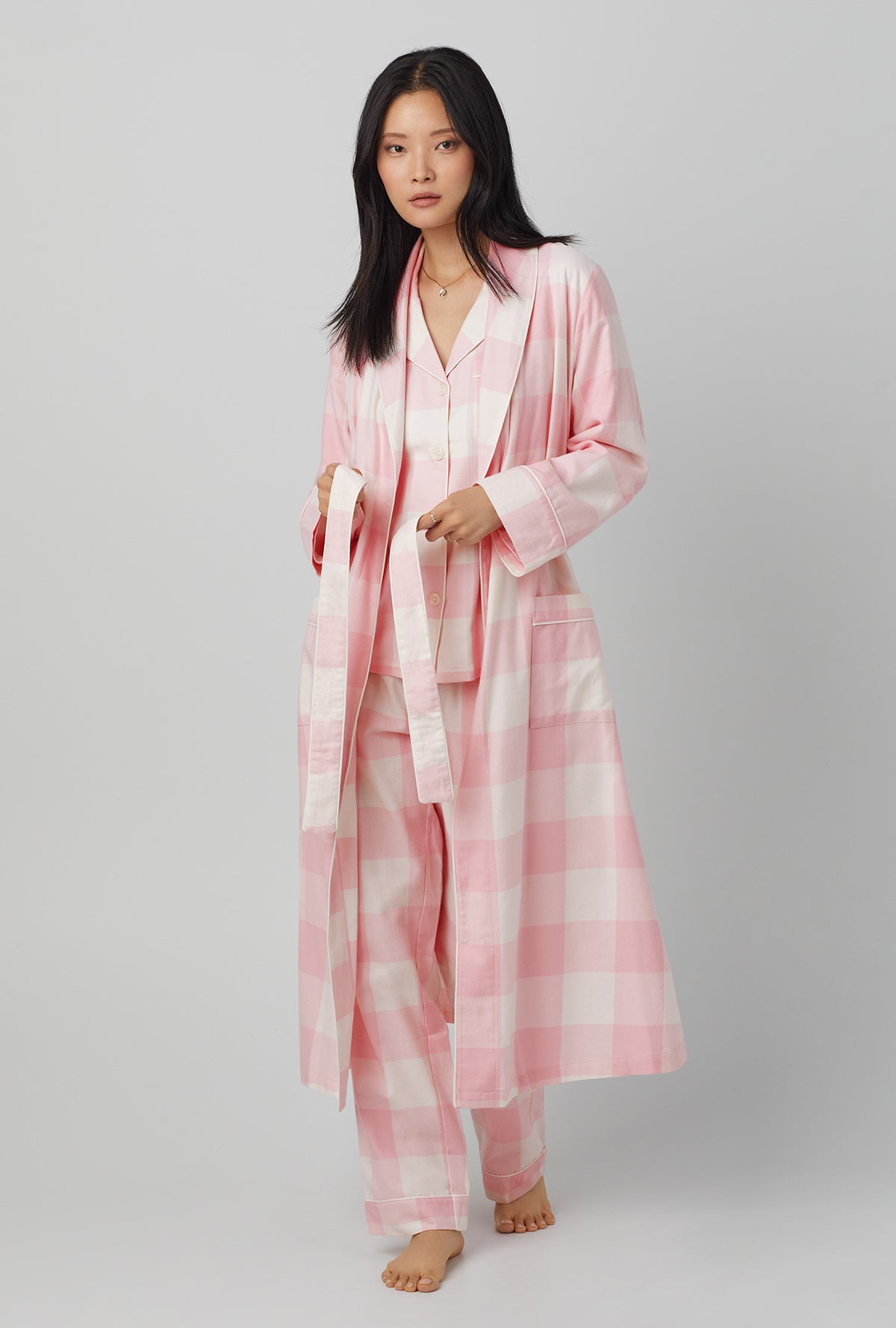 A lady wearing classic woven cotton flannel robe with checking in print