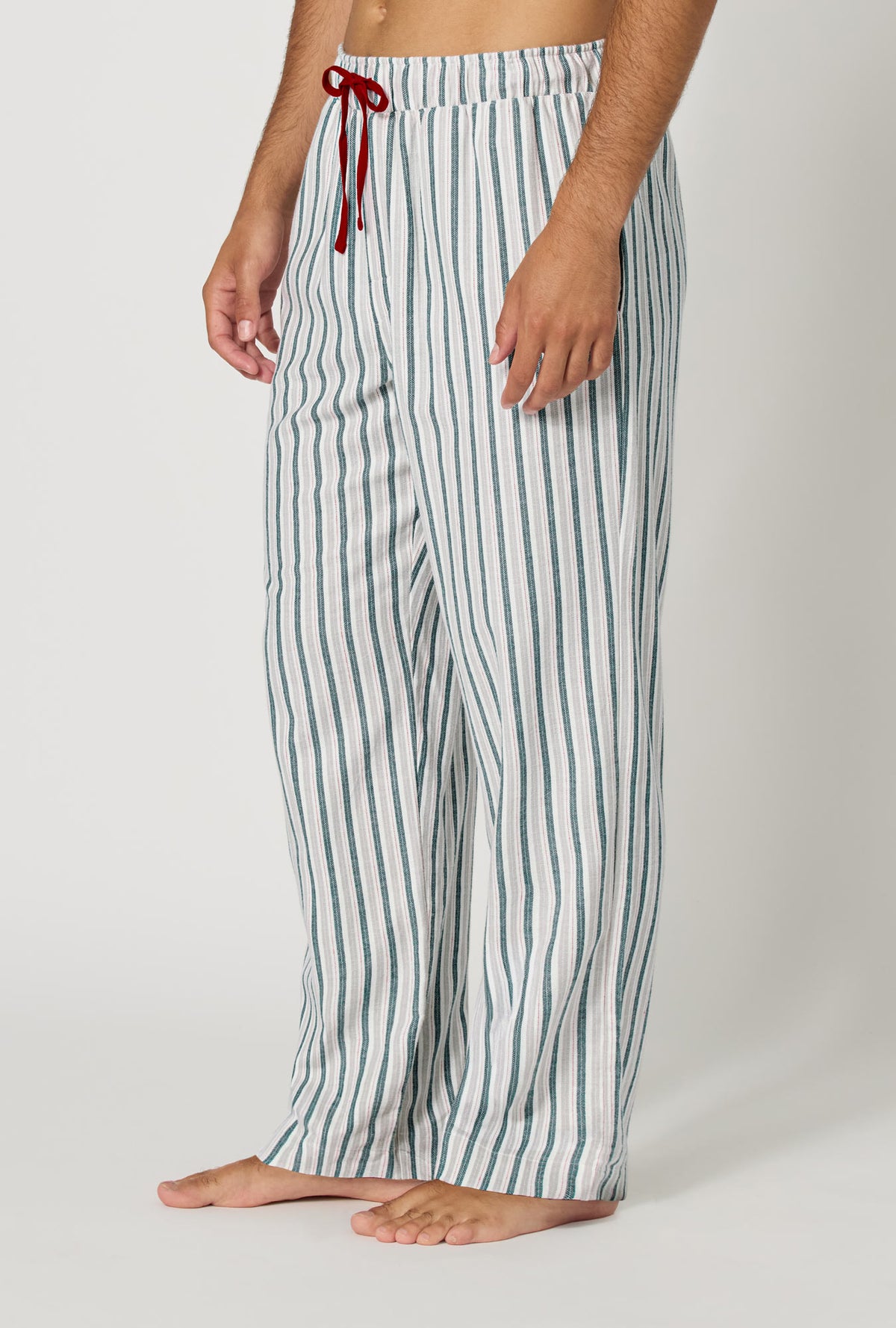 A man wearing Peppermint Stripe Men's Woven Portuguese Flannel Pj Pant side view