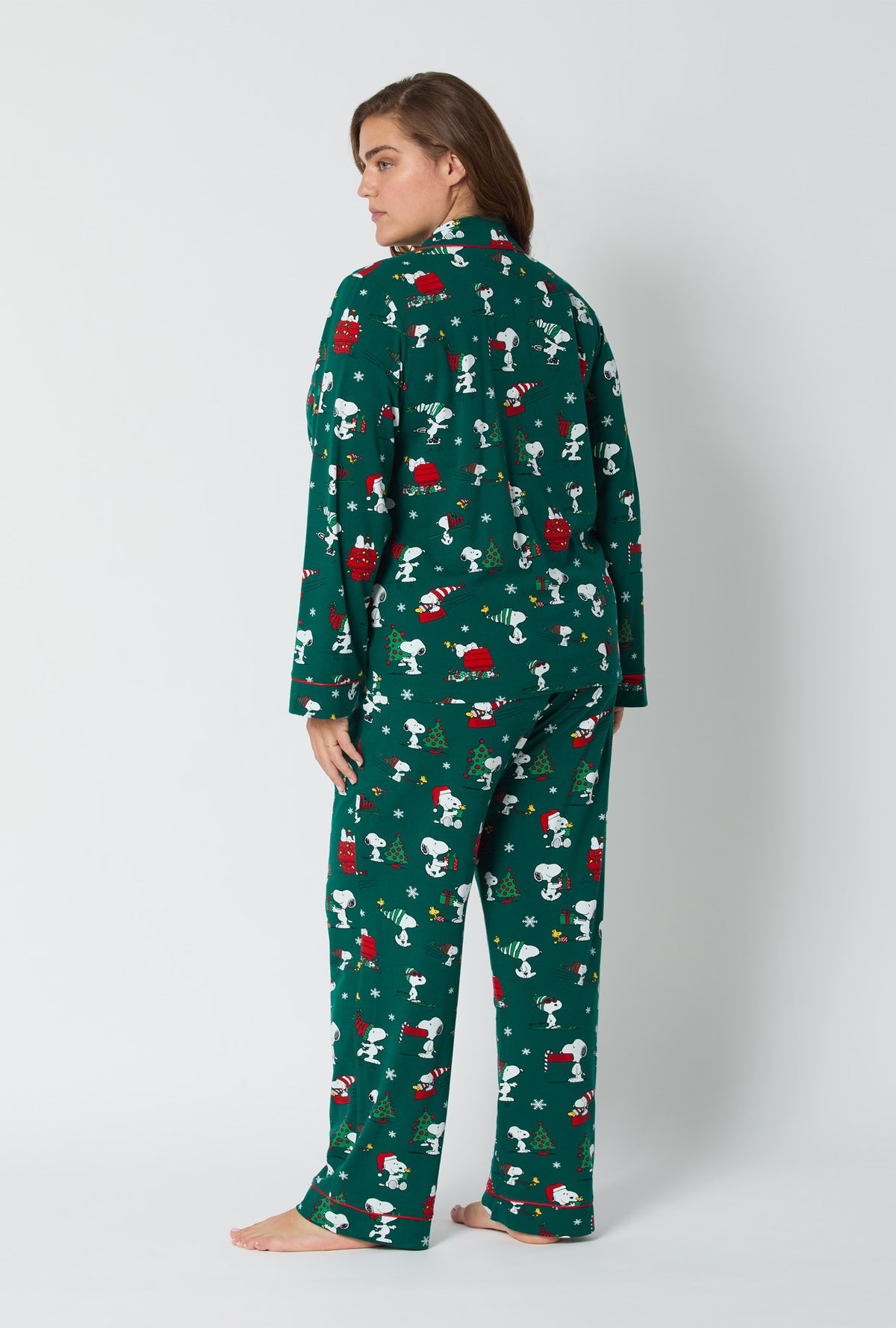 A lady wearing ®Snoopy's Holiday Fun Long Sleeve Classic Stretch Jersey Pj Set