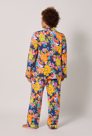 A lady wearing plus size BedHead x Trina Turk Bay Street Bloom Long Sleeve Classic Stretch Jersey Pj Set