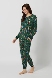 A lady wearing Rifle Paper Co. x BedHead PJs Nutcracker Long Sleeve Pullover Crew And Jogger Stretch Jersey Pj Set looking down