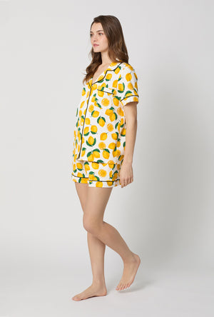 A lady wearing White and  Yellow Short Sleeve Classic Shorty Stretch Jersey Pj Set side view