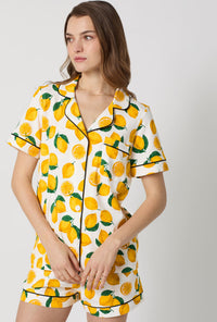 A closeup of A lady wearing White and  Yellow Short Sleeve Classic Shorty Stretch Jersey Pj Set