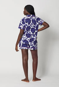 A lady wearing Blue and  White Short Sleeve Classic Shorty Stretch Jersey Pj Set back view
