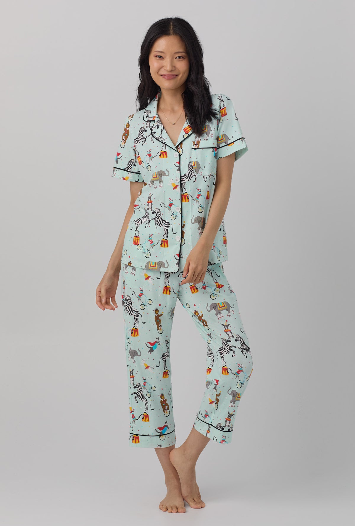 A lady wearing Short Sleeve Classic Stretch Jersey Cropped PJ Set with circus ring print
