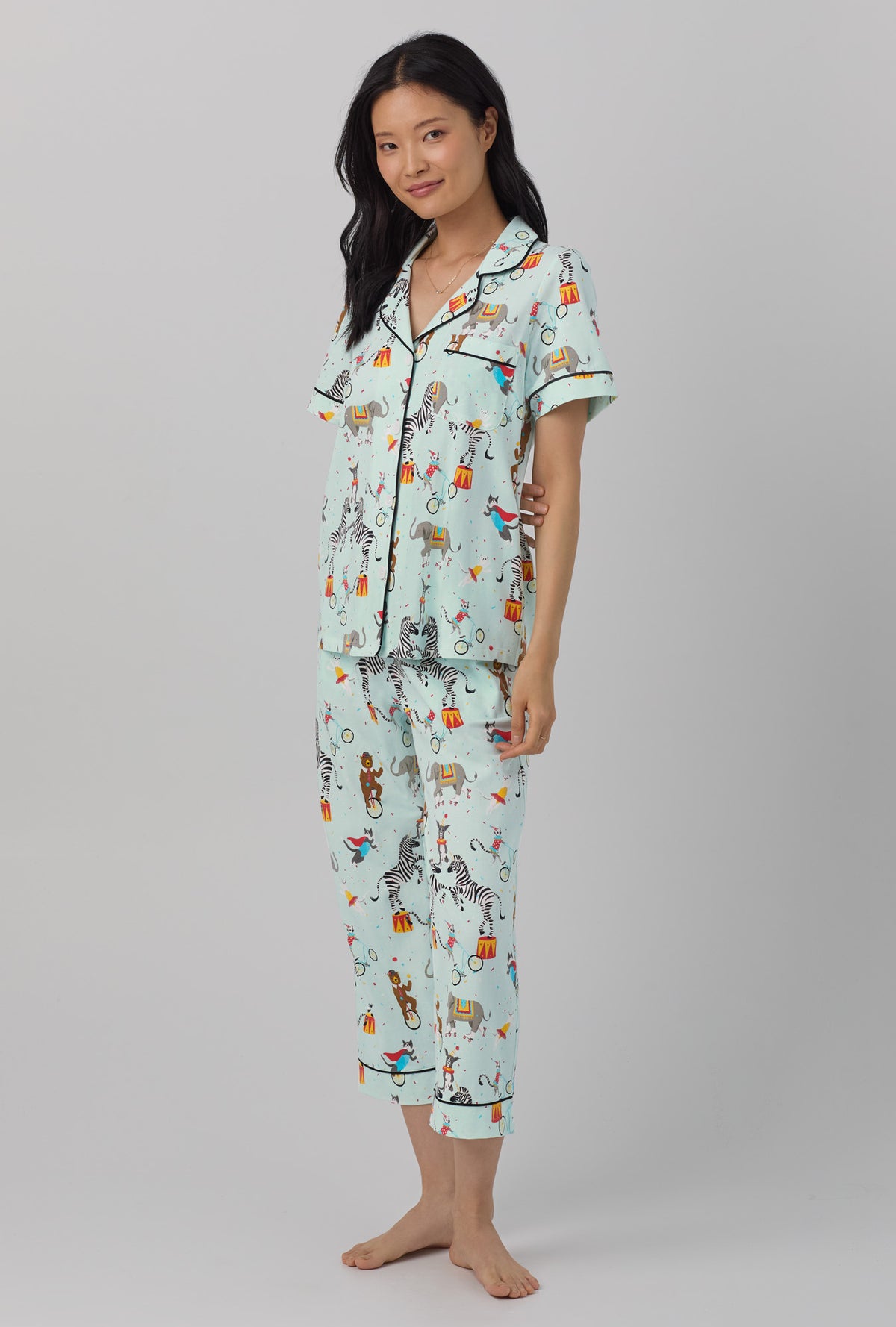 A lady wearing Short Sleeve Classic Stretch Jersey Cropped PJ Set with circus ring print