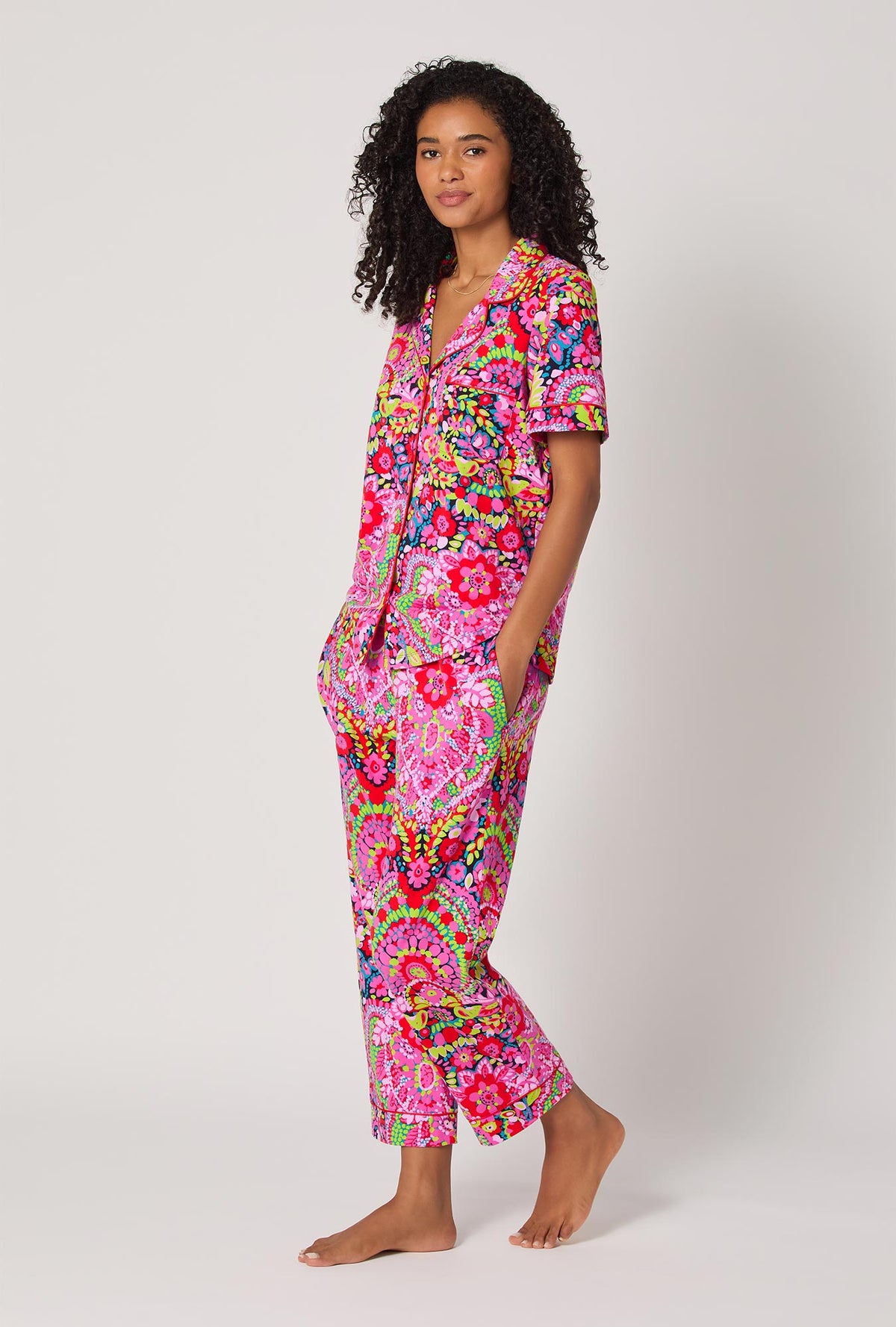 A lady wearing BedHead x Trina Turk Las Flores Short Sleeve Classic Stretch Jersey Cropped Pj Set