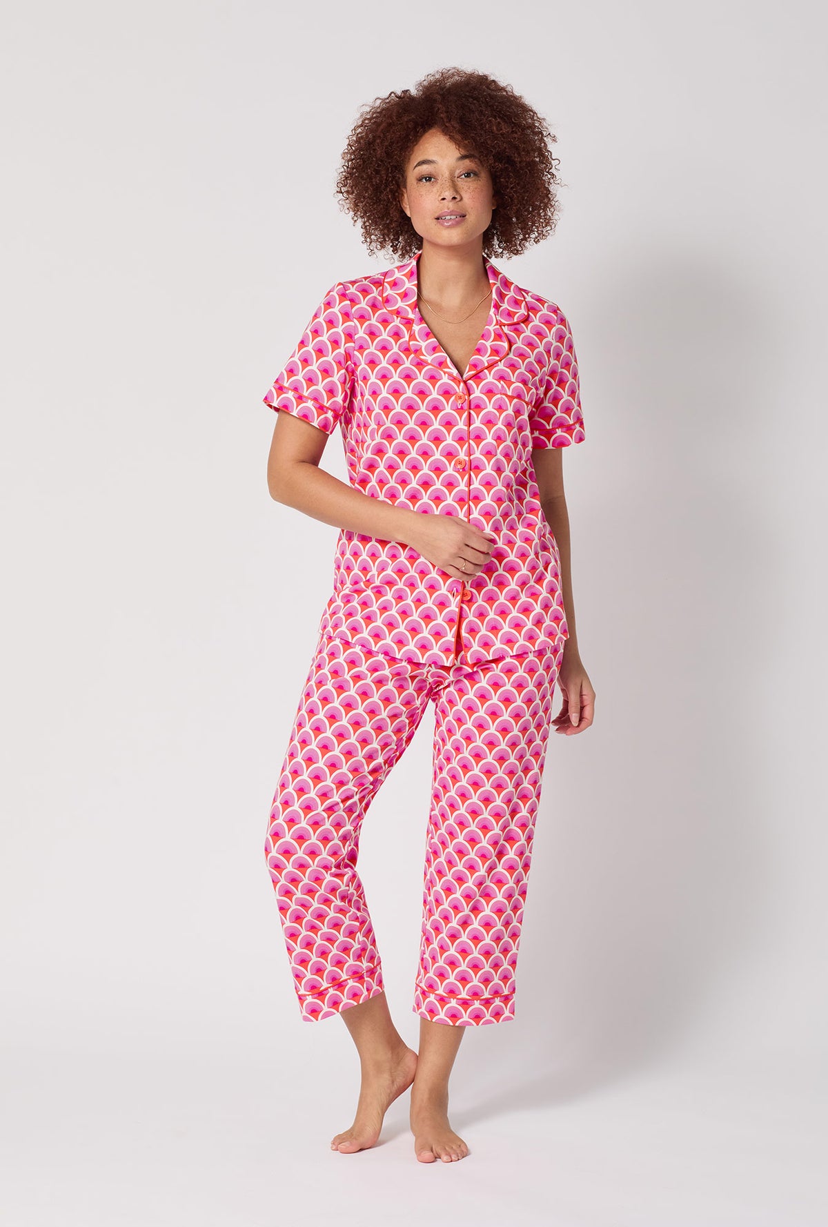 A lady wearing BedHead x Trina Turk Scallop Short Sleeve Classic Stretch Jersey Cropped Pj Set