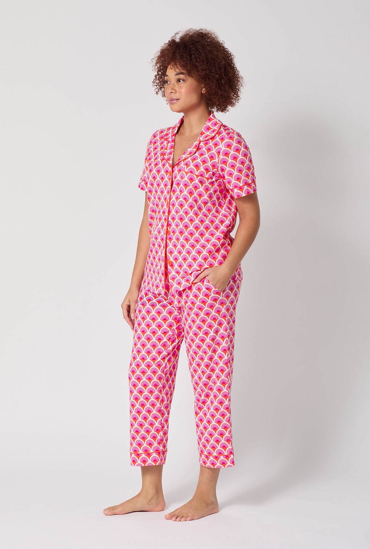 A lady wearing BedHead x Trina Turk Scallop Short Sleeve Classic Stretch Jersey Cropped Pj Set