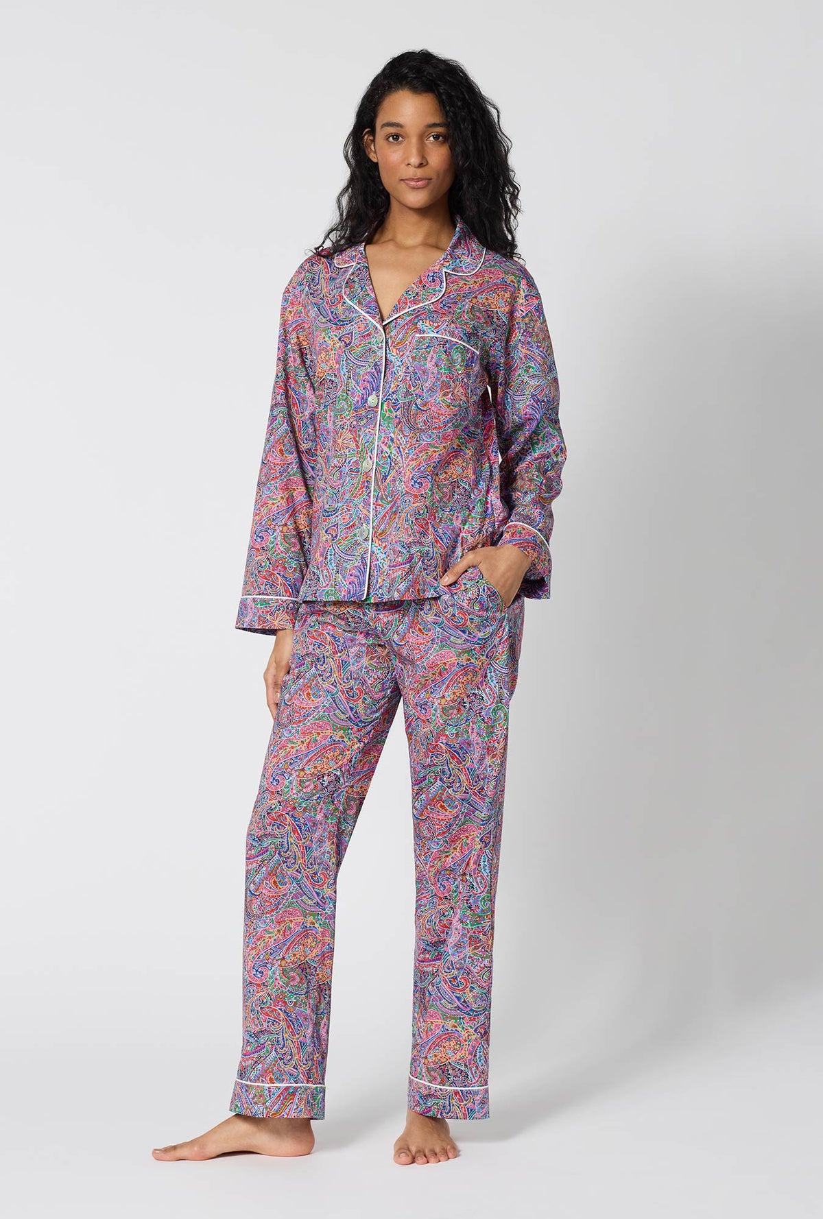 A Lady Wearing Dana Sharmin Long Sleeve Classic Woven Tana Lawn® Pj Set Made With Liberty Fabrics in a front faced standing pose