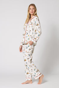 A Lady Wearing Snoopy's Game Day Long Sleeve Classic Stretch Jersey Pj Set in a side angled pose