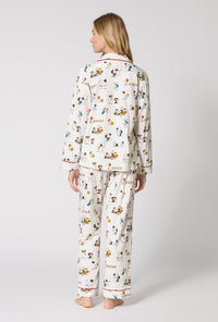 A Lady Wearing Snoopy's Game Day Long Sleeve Classic Stretch Jersey Pj Set in a back view pose