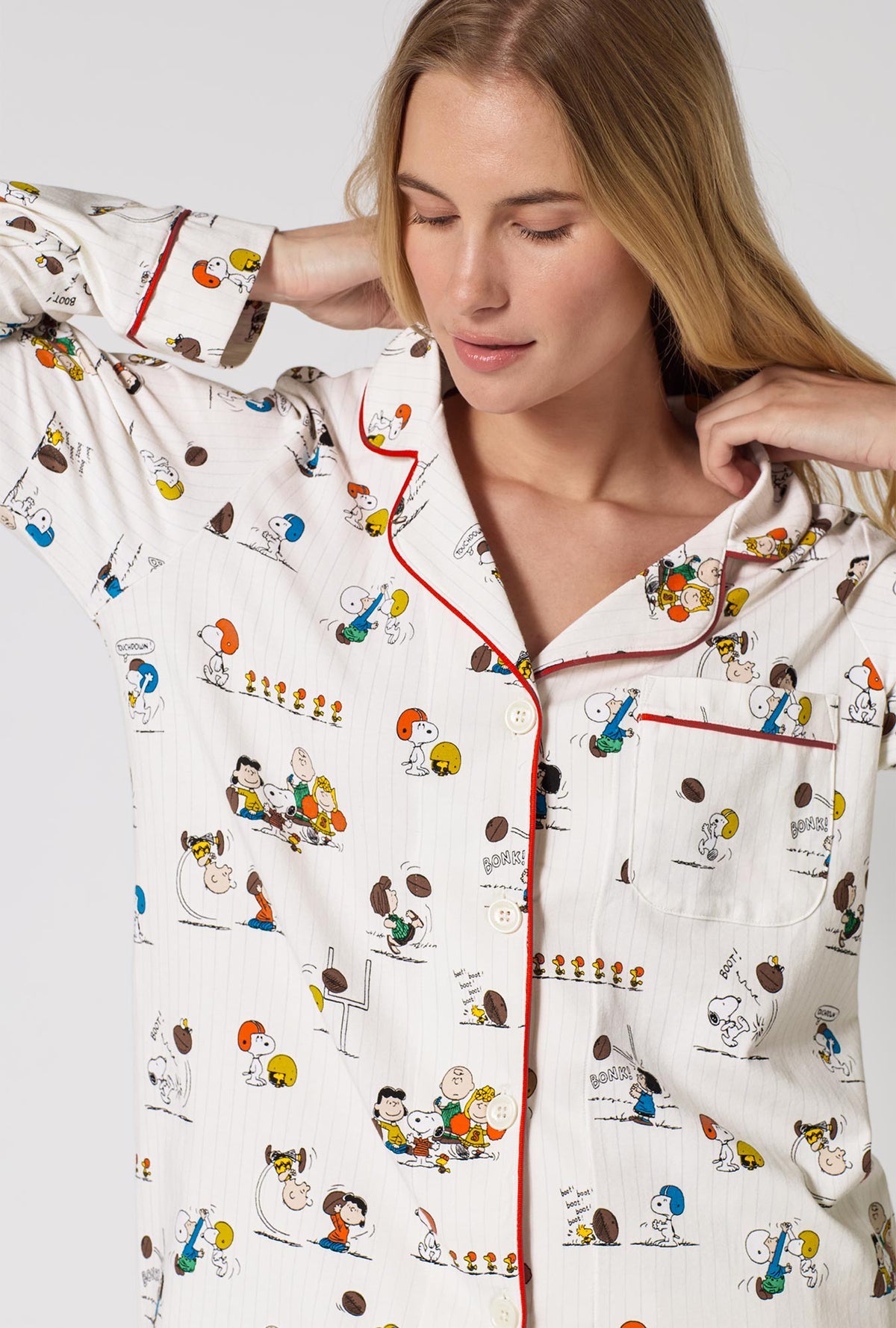 A Lady Wearing Snoopy's Game Day Long Sleeve Classic Stretch Jersey Pj Set in a front close up view shot