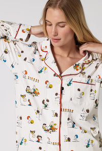 A Lady Wearing Snoopy's Game Day Long Sleeve Classic Stretch Jersey Pj Set in a front close up view shot