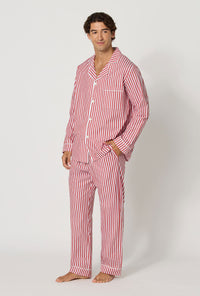 A man wearing Red Signature Stripe Men's Long Sleeve Classic Woven Cotton Sateen Pj Set looking side