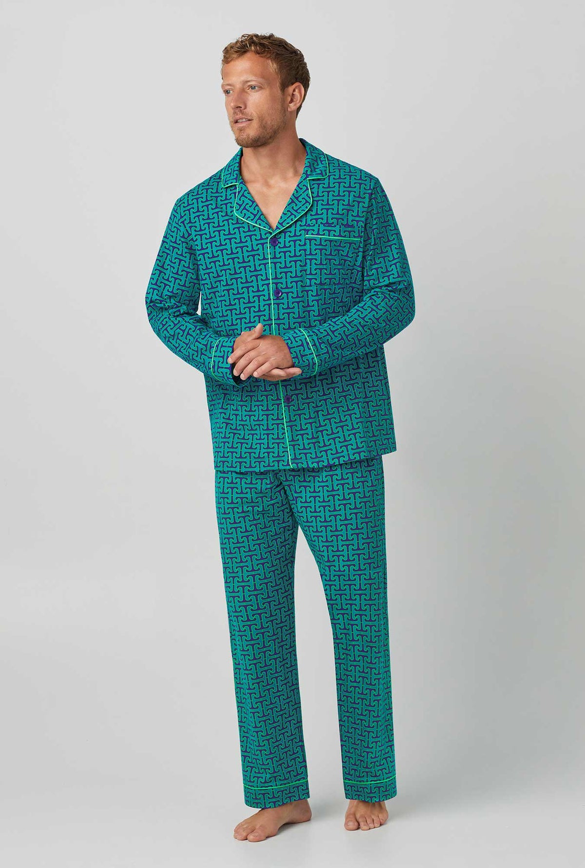 A man wearing green Long Sleeve Classic Stretch Jersey PJ Set with Tile Mens Henle print