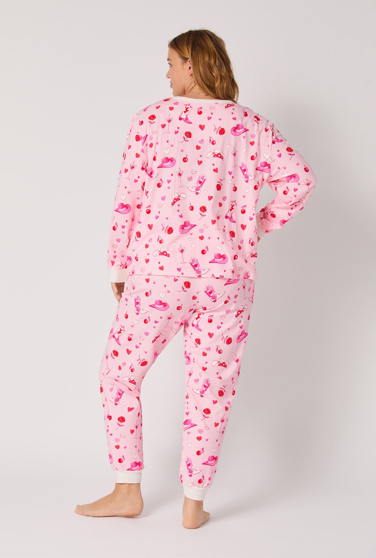 A lady wearing Giddy Up Galentine Long Sleeve Pullover Crew And Jogger Stretch Jersey Pj Set