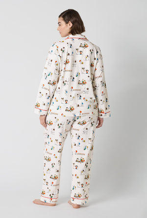 A Lady Wearing Plus Size Snoopy's Game Day Long Sleeve Classic Stretch Jersey Pj Set in a back view pose