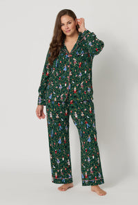 A lady wearing plus size Rifle Paper Co. x BedHead PJs Nutcracker Long Sleeve Classic Stretch Jersey Pj Set 