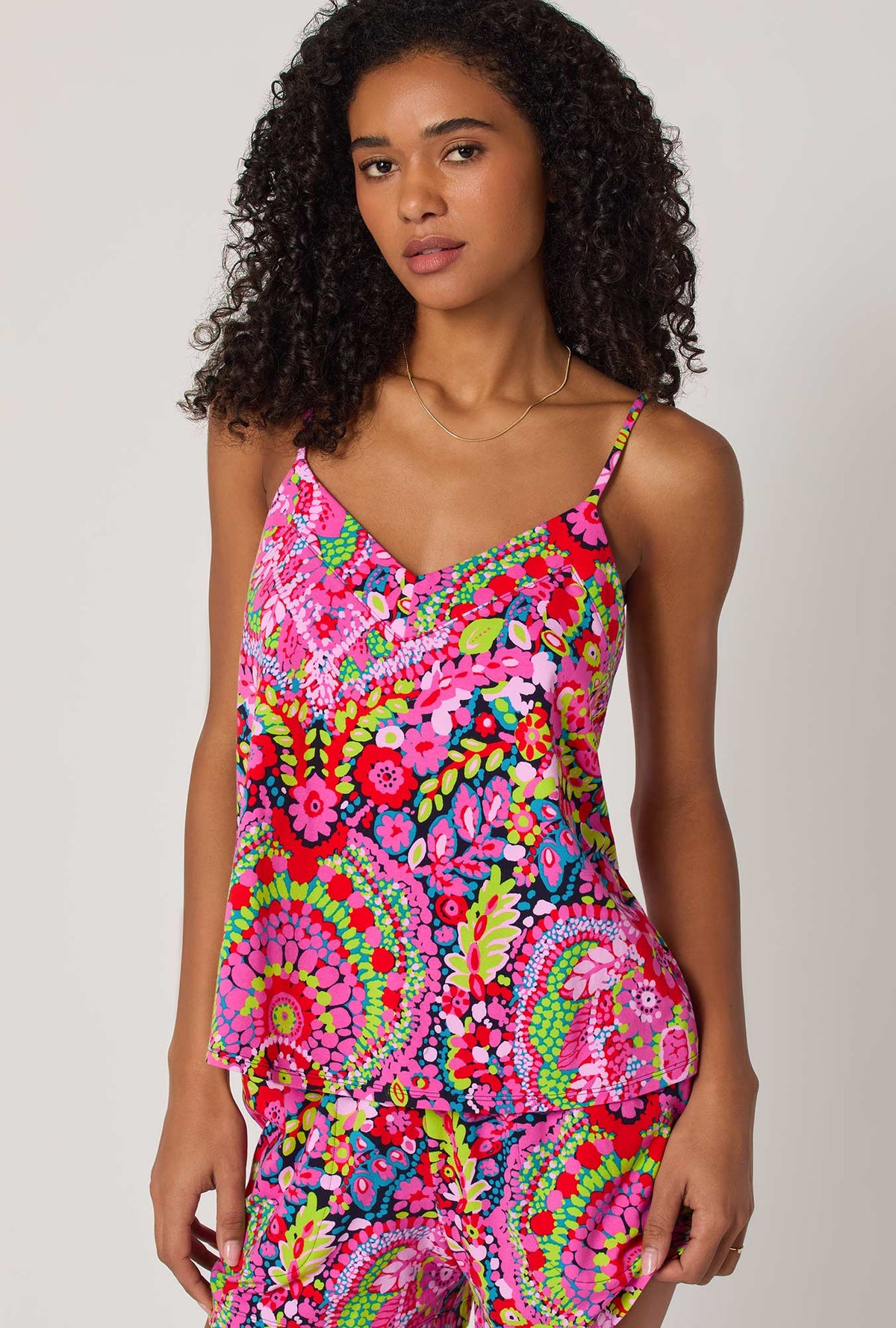 A lady wearing BedHead x Trina Turk Las Flores Cami Shorty Stretch Jersey Pj Set