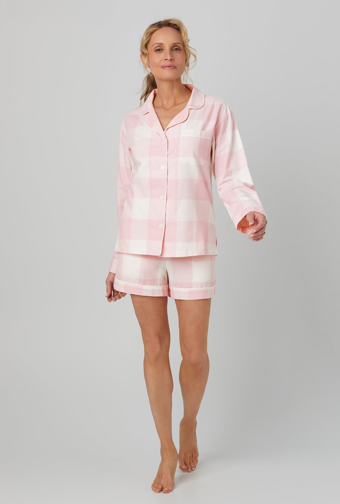 A lady wearing long sleeve shorty flannel twill pj set with checking in print