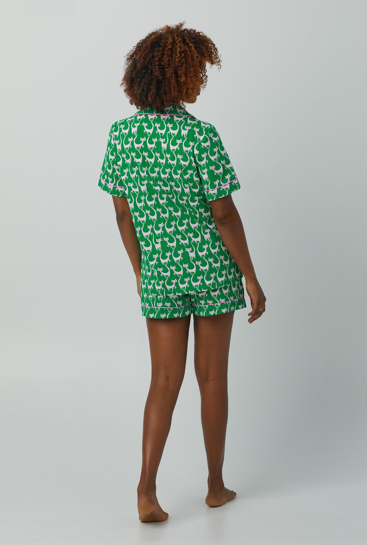 A lady wearing green Short Sleeve Classic Shorty Stretch Jersey PJ Set with Cool Cats print