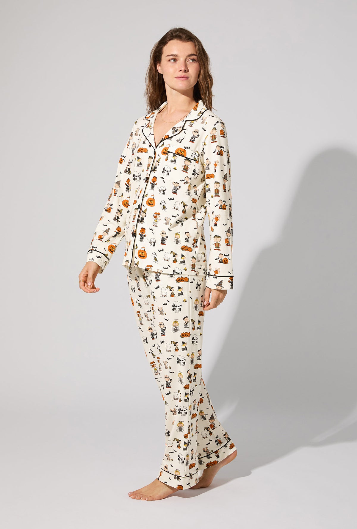 A lady wearing Peanuts® Snoopy&#39;s Halloween Long Sleeve Classic Stretch Jersey PJ Set