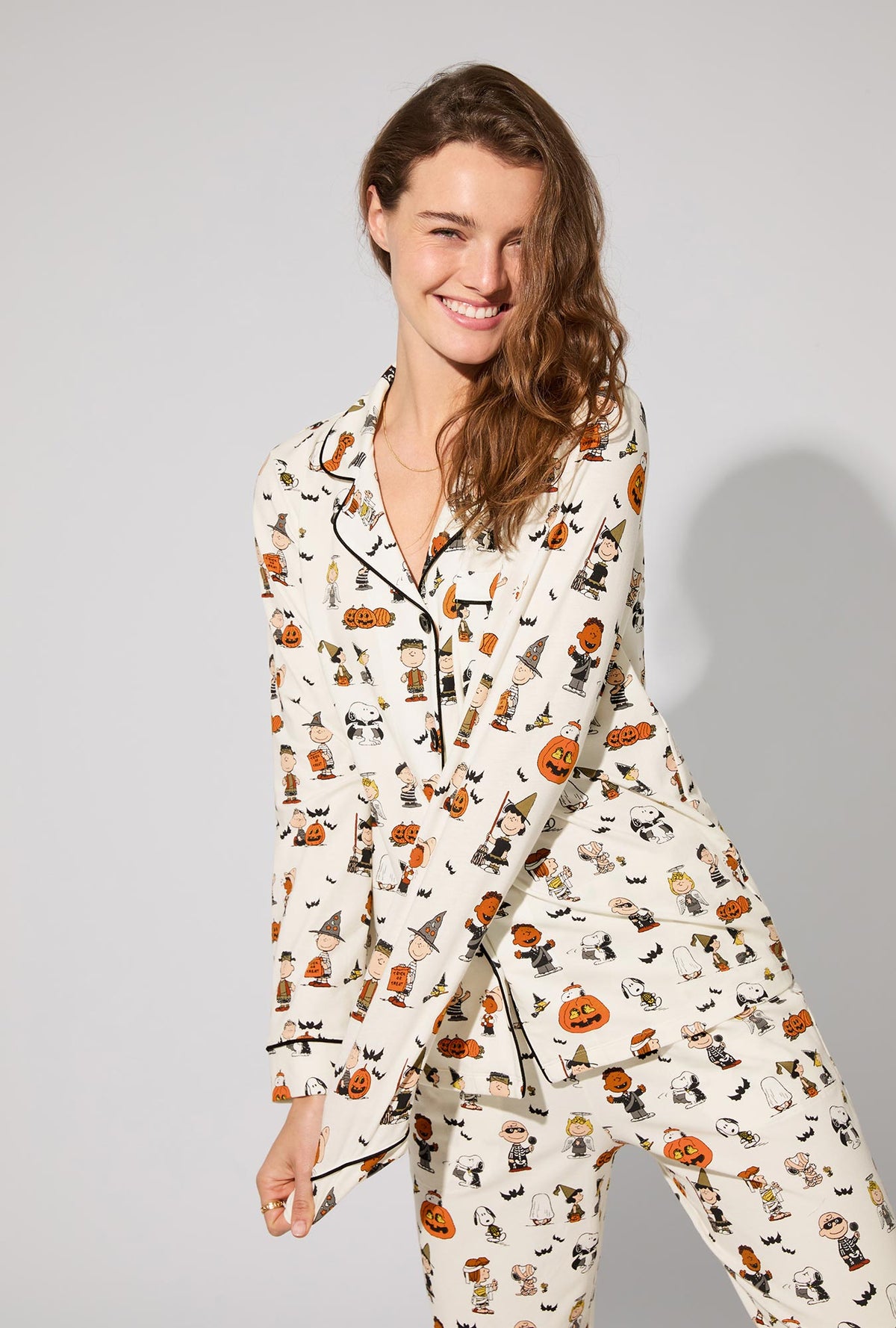 A lady wearing Peanuts® Snoopy&#39;s Halloween Long Sleeve Classic Stretch Jersey PJ Set