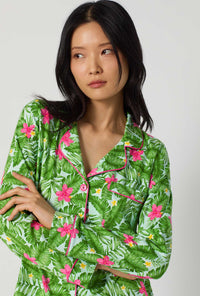 A Lady Wearing Monstera Bloom Long Sleeve Classic Stretch Jersey Pj Set posing in a half zoomed close up view