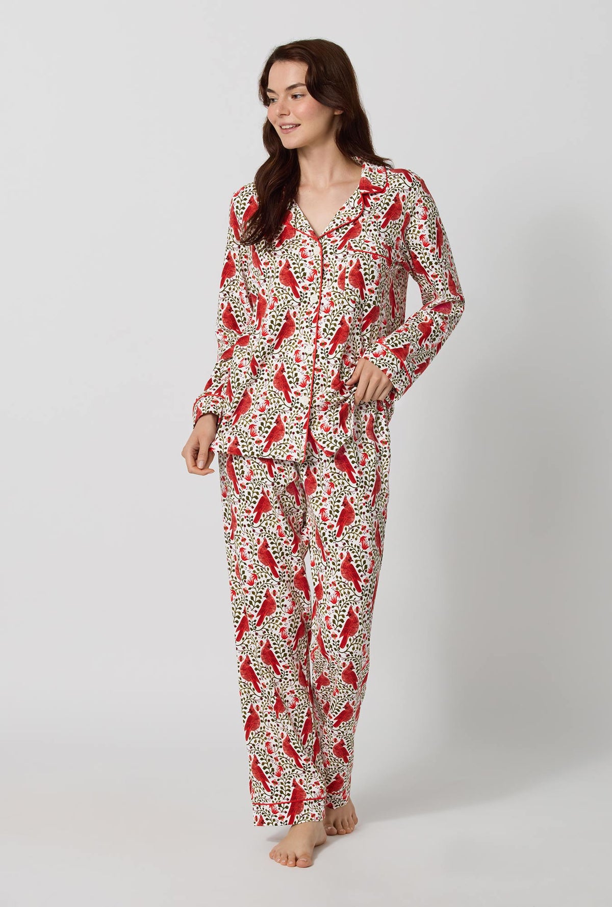 A lady wearing Rifle Paper Co. x BedHead PJs Cardinals Long Sleeve Classic Stretch Jersey Pj Set