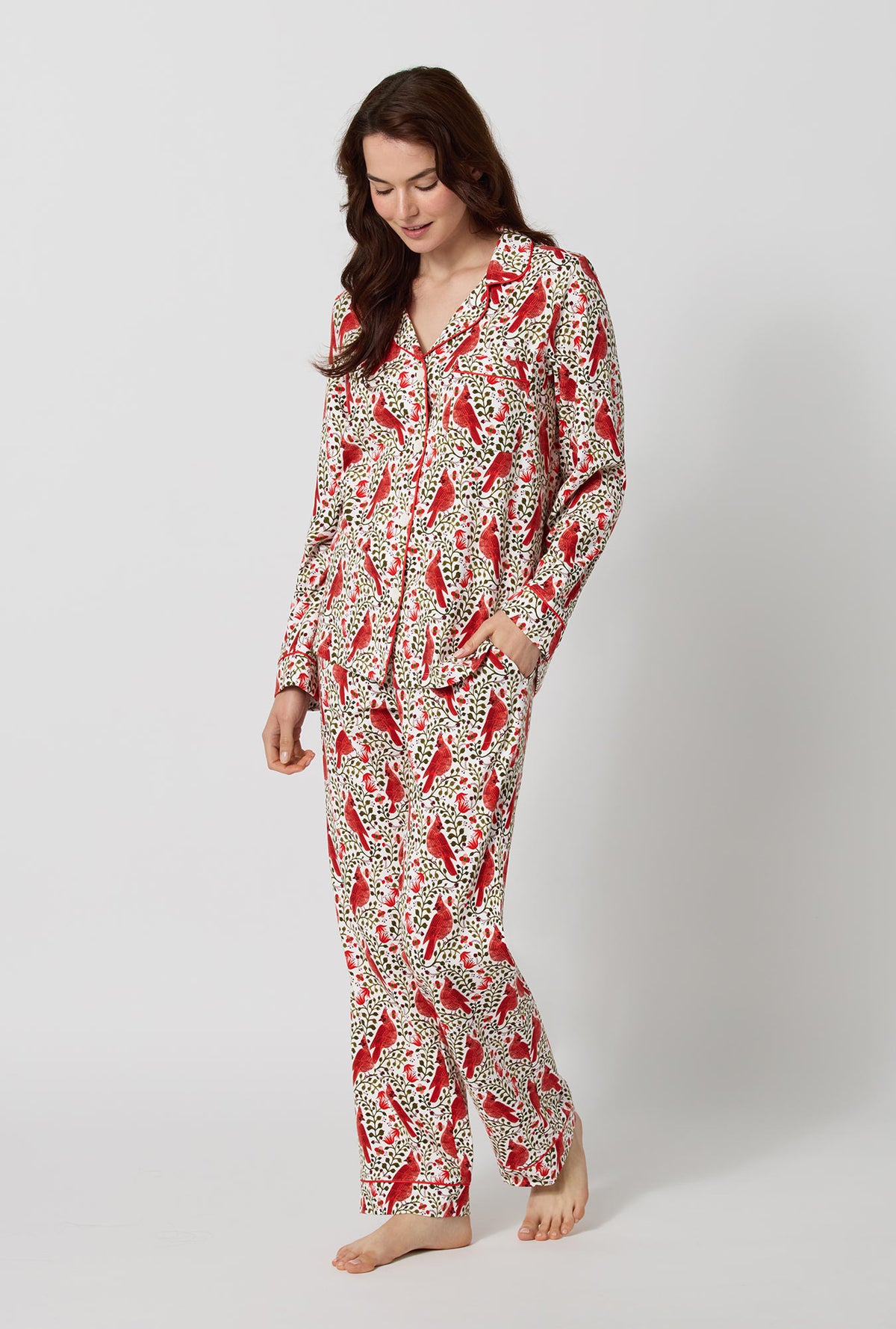 A lady wearing Rifle Paper Co. x BedHead PJs Cardinals Long Sleeve Classic Stretch Jersey Pj Set looking down