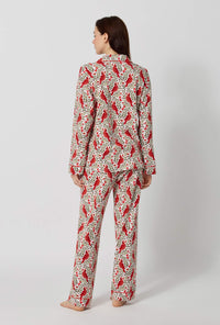 A lady wearing Rifle Paper Co. x BedHead PJs Cardinals Long Sleeve Classic Stretch Jersey Pj Set back view