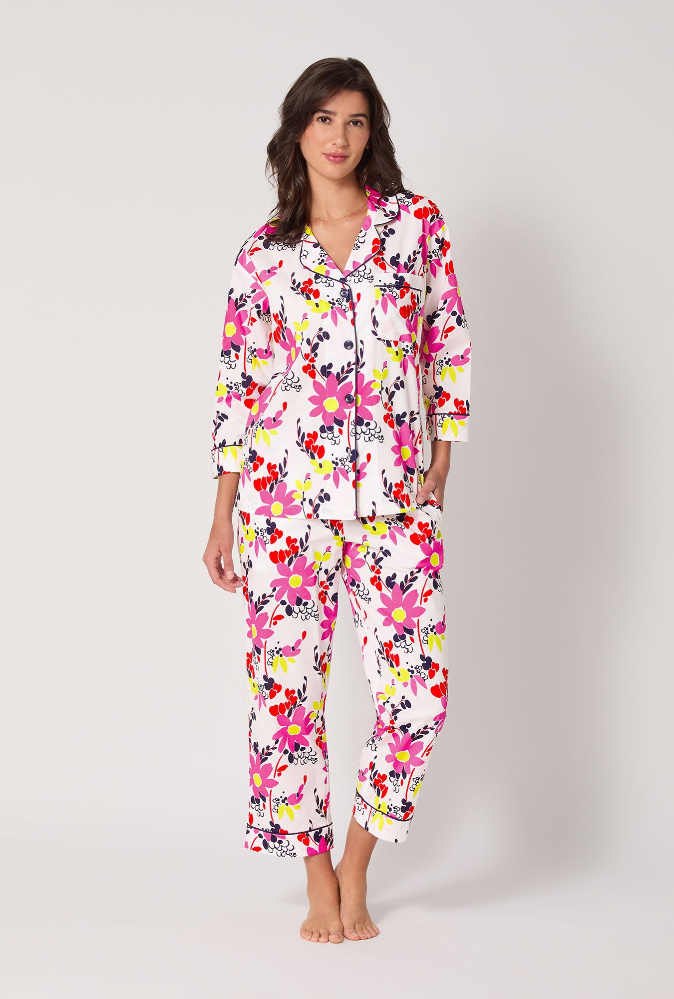 A lady wearing BedHead x Trina Turk Whimsical Floral 3/4 Sleeve Classic Woven Cotton Cropped Pj Set