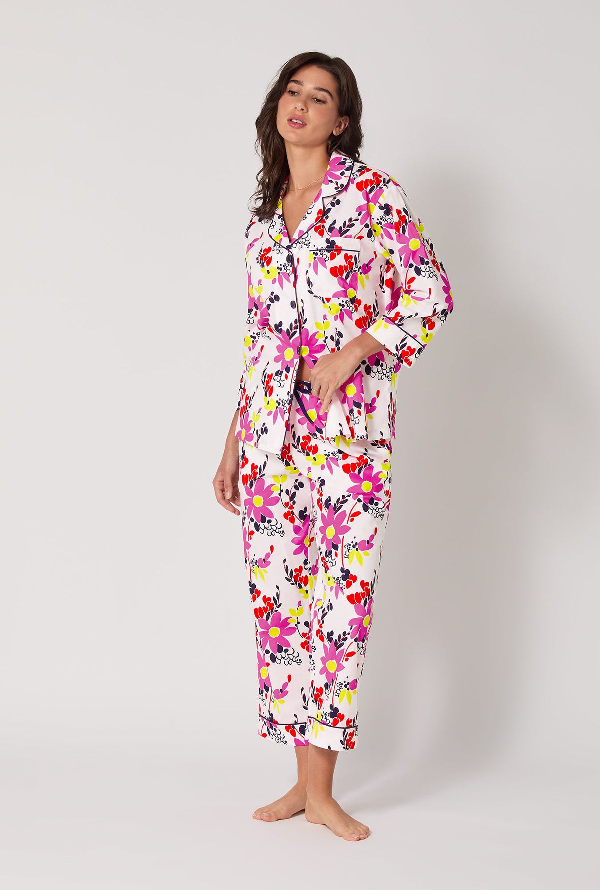 A lady wearing BedHead x Trina Turk Whimsical Floral 3/4 Sleeve Classic Woven Cotton Cropped Pj Set