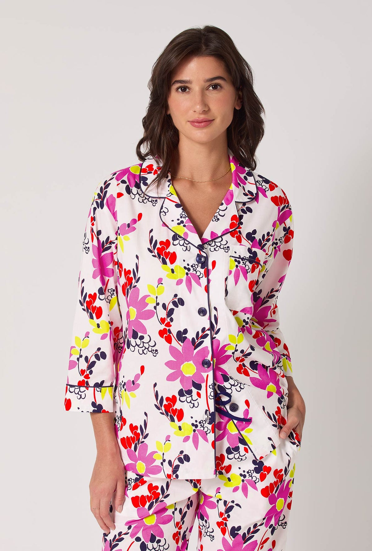 A lady wearing BedHead x Trina Turk Whimsical Floral 3/4 Sleeve Classic Woven Cotton Cropped Pj Set